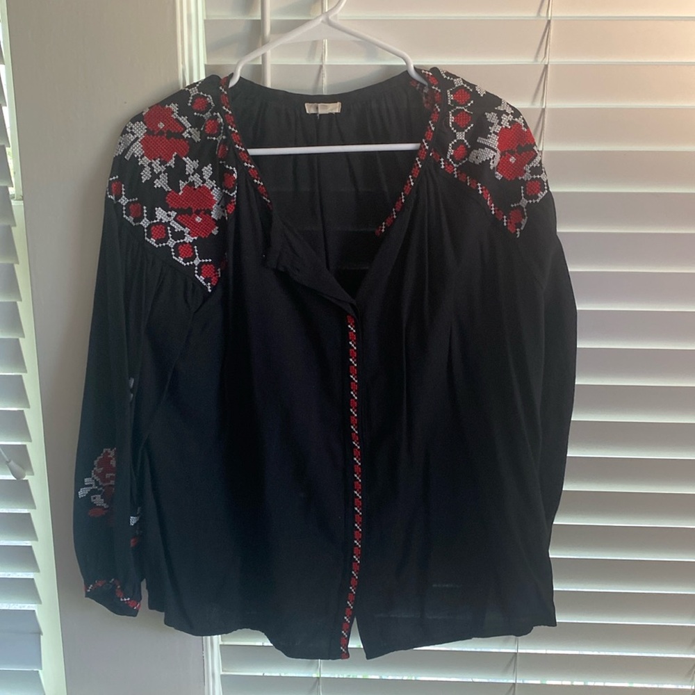 Black peasant top with red and white cross-stitch embroidery